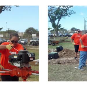 Kevin Wong working with other volunteers digging a hole.