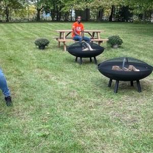 Home Depot Team members seated at picnic tables.