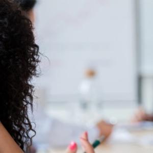 a group of professionals, three in the background are blurry