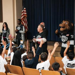 To support the bike giveaway, the LA Kings Ice Crew and staff volunteers assembled the bikes and alumni Daryl Evans, and mascot Bailey hosted a school assembly.