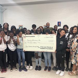 KeyBank and Family Services leaders gather with TRAC teens to celebrate KeyBank’s support.  Adults pictured from left:  Trish Prunty, Family Services VP, Philanthropy; Anthony Guzzo, KeyBank Branch Manager, Irenee Provenzano, KeyBank Area Retail Leader; Brian Muse, TRAC Youth Services Coordinator; Dan Butler, TRAC Youth Outreach Worker; Rita McPeck, KeyBank Senior Service Officer; Whitney Humphrey, Family Services VP, Community Programs. 
