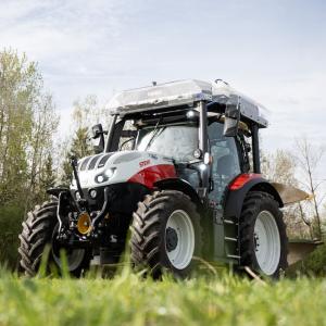 red tractor working in field