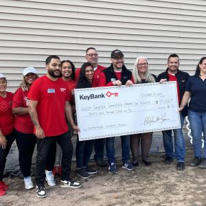 Photo: (from left) KeyBank branch employees Janis Deynes, Sharia Coley, Josh Flores, Norbert Grant III, Priya Tater, Tom Morace, Jeff Guyott,  Kendle Taylor, and Holyoke Branch Manager Tito Ramon who presented the grant check to Habitat for Humanity’s Executive Director Aimee Giroux (far left). 