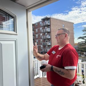 Habitat for Humanity volunteer working on a door frame.