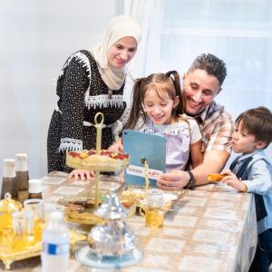 Family sitting at table together 