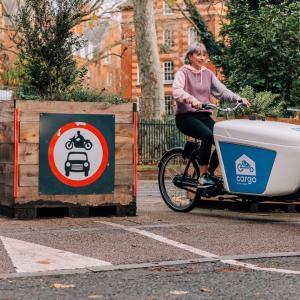 A person riding a cargo bike