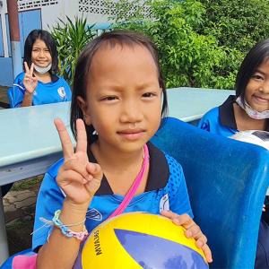 Students in Thailand seated at a table.