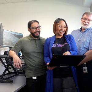 HARMAN Engineer Kelly with coworkers.