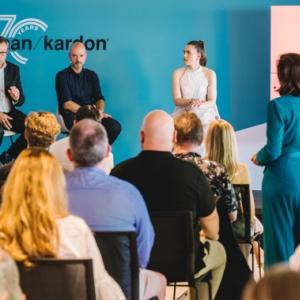 Harman Kardon team members in a meeting.