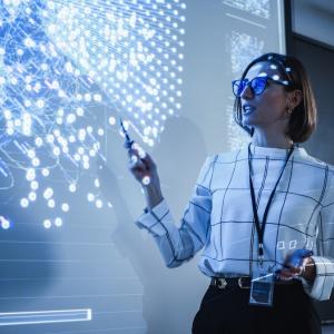 Woman presenting at large screen
