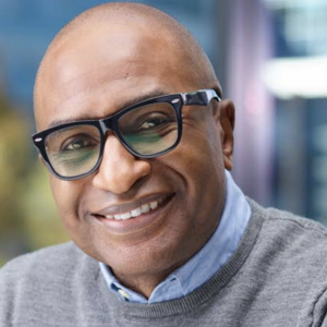 Photo of a person smiling wearing glasses