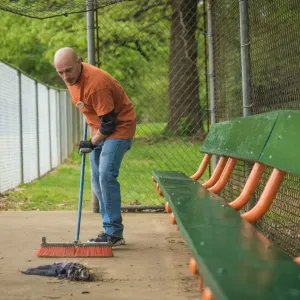 A volunteer cleaning up trash