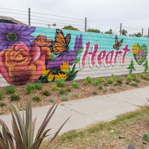 mural on a wall "Heart Harbor" with flowers, produce