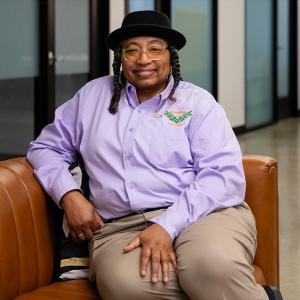 Helen Mathis seated on a couch