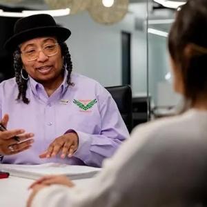 Helen Mathis speaking to a customer