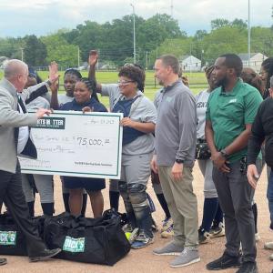 High Point HS team receiving a Sports Matter grant check.