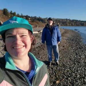 Hillary Jeffrey shown with her partner on the seashore.