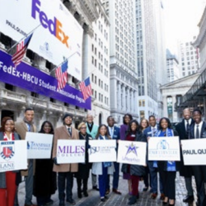 A large group of people holding signs with logos on 