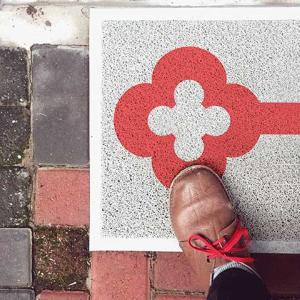 KeyBank logo on a doormat welcoming a person into a home.