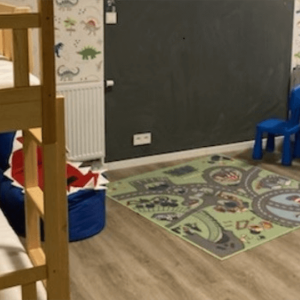 bedroom with bunk beds and a small table with chairs