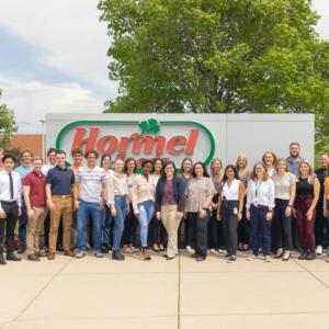 Hormel Interns in front of sign