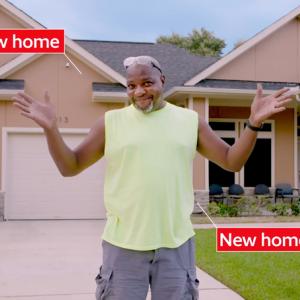 Man standing in front of house