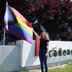 Francie Huebner holding a pride flag