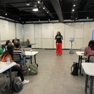 teacher in front of a modern classroom