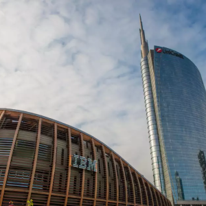 Exterior of a building with "IBM" on the side. A tall skyscraper behind it.