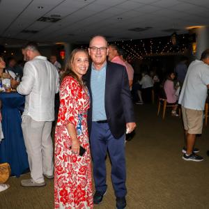 Two people at Homeruns & Highballs fundraiser