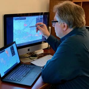 Tom Rolinski at computer