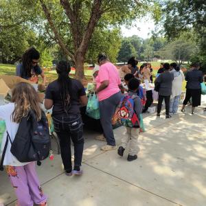 Families shopping together at Free Produce Market