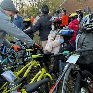 Kids in helmets with bikes