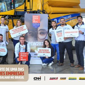 group holding signs celebrating Great Place to Work certification