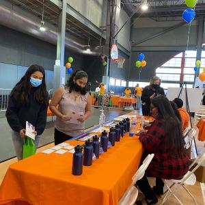event banquet table with people looking at items
