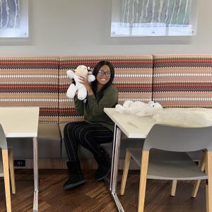 Covia employee poses with teddy bear for charities and hospitals