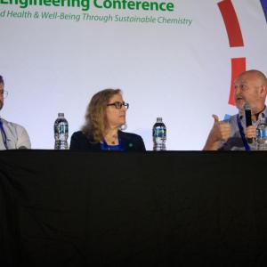 Three chemistry professors on stage at the Annual Green Chemistry and Engineering Conference