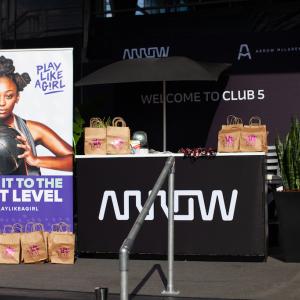 Photo of the Arrow booth with a Play Like a Girl banner