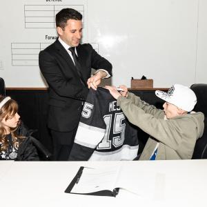 Joshua signed a special “contract” with Jake Goldberg, the LA Kings Senior Director of Hockey Operations.