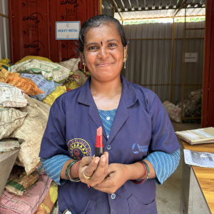 holding up VIVA GLAM lip stick