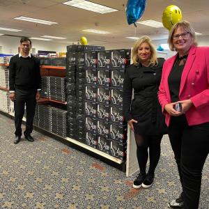 the logitech and World Vision team pose together 