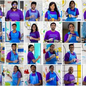 Hyderabad employees paint murals on the school walls. 