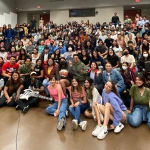 Group of students shown in a class room.