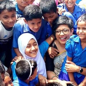Young students in Bangladesh shown with their teacher.
