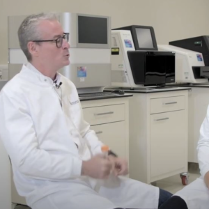 Dr. Erskine Willerslev seated with another scientist. 