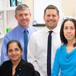 Dr. Mike Friez (second from left) directs Greenwood’s diagnostic laboratories. From left to right, he is joined by Associate Director Fatima Abidi, PhD; Associate Director Raymond Caylor, PhD; and Lead Director Jennifer A. Lee, PhD, all of Greenwood’s Molecular Diagnostic Laboratory.