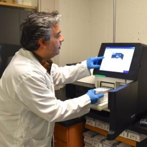 Dr. Mehrdad Hajibabaei works with the Illumina MiSeq System in his lab at the Centre for Biodiversity Genomics, University of Guelph. | Photo: Courtesy of University of Guelph