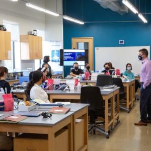 Education Director John Doyle, PhD, instructs Gloucester Biotechnology Academy students directly from the lab bench, allowing more time for hands-on learning.