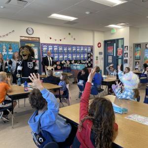 Students ask questions during the reading of "B is for Bailey".