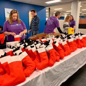 volunteers pack stockings full 